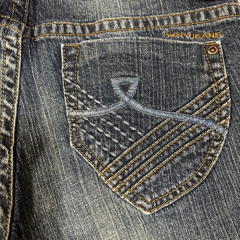 DKNY JEANS.    Size 6. Faded distressed Bootcut dark denim jeans.